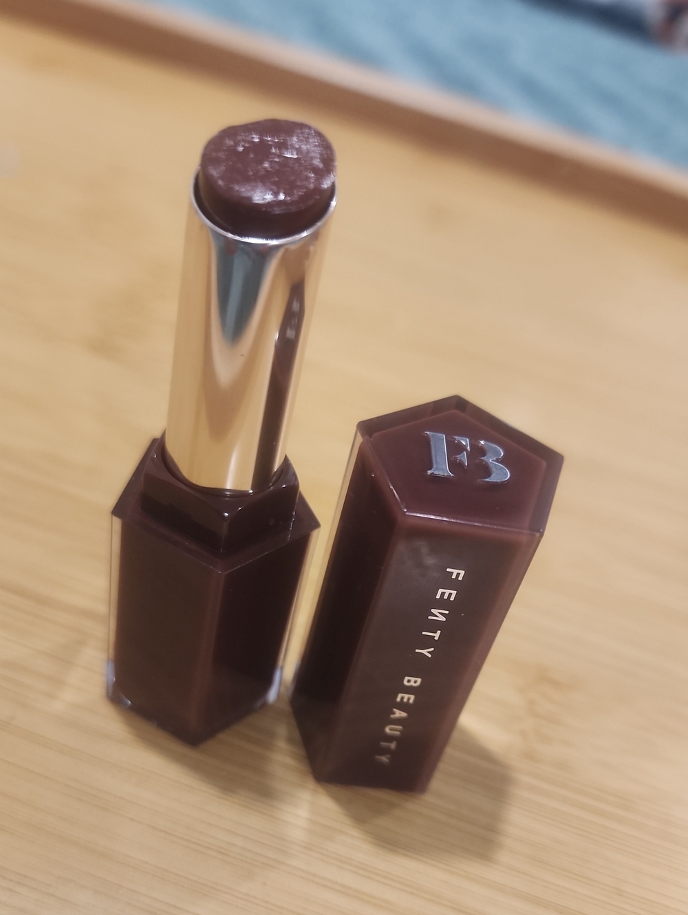 Fenty Beauty lipstick — deep chocolate brown